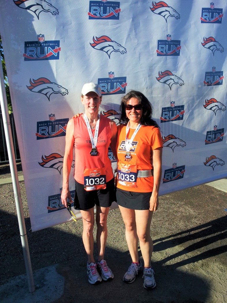 two women after running a 5K race in Denver 
