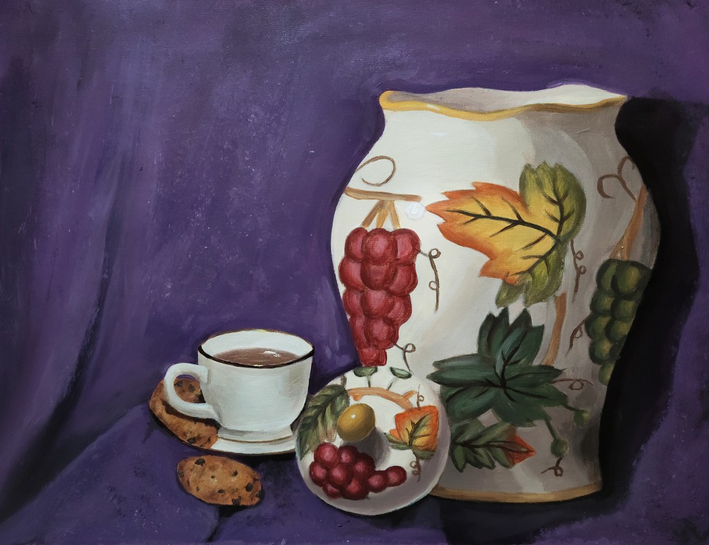painting by artist Lexi Finnegan, autumn-themed pottery piece, red grapes, orange and green leaves, with a white cup of tea and chocolate chip cookies on a blue backdrop