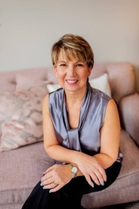 author, Patti Hornstra, full shot sitting down 